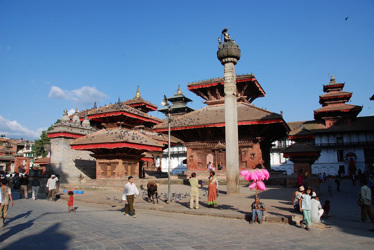 Kathmandu Durbar Square 06 01 Jagannath Temple and King Malla Column Running northeast is a second part of Kathmandu Durbar Square, which contains the entrance to the Hanuman Dhoka and an assortment of temples. Pigeons fly around the three-tiered, two-storied Jagannath Temple, built in the 16C. Exquisite wood-carvings embellish the doors, windows and roof struts, depicting Hindu gods. Erected in 1670, King Pratapa Malla's column stands to the left of Jagannath temple. The king sits on a lion throne atop the lotus-shaped capital, his two wives one on either side. The King's five sons also appear, one at each corner and the fifth, the youngest son, in front. On the right is the Hanuman statue at the entrance to the Hanuman Dhoka palace.